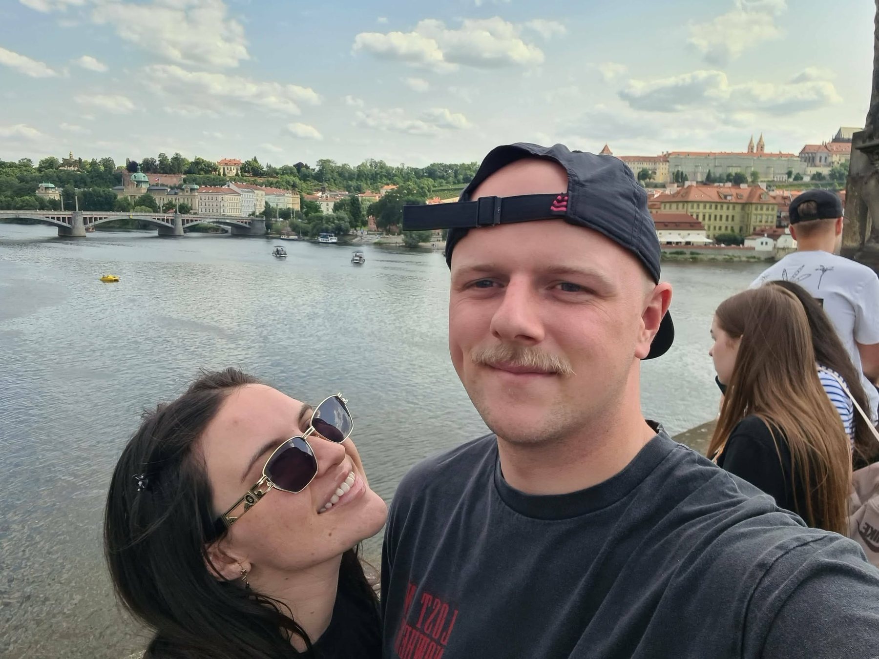 Bianca and Thomas by the river in Prague
